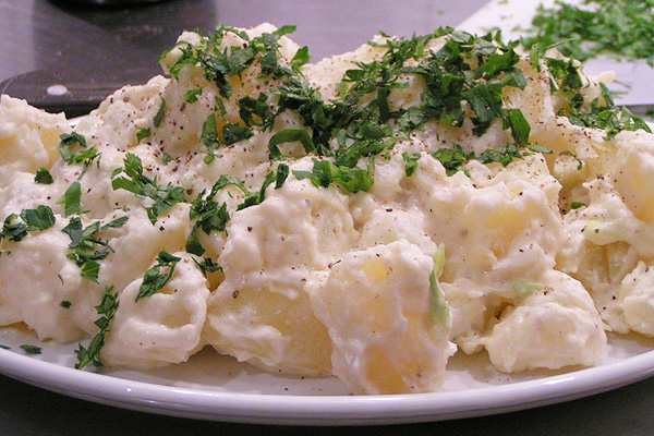 warm potato salad with soft cheese and scallion